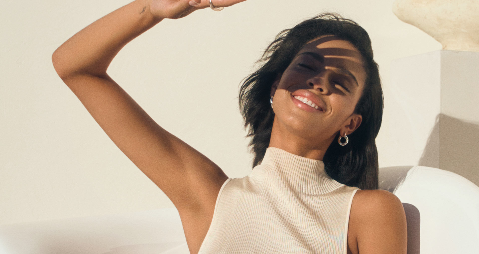 Woman protecting face from sun